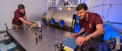 Graduate header 1 Student researchers engage in fundamental and applied plasma physics experiments using AOE’s state-of-the-art facilities, including the plasma vacuum chamber.