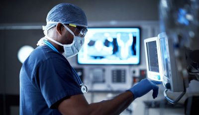 doctor works on computer screen